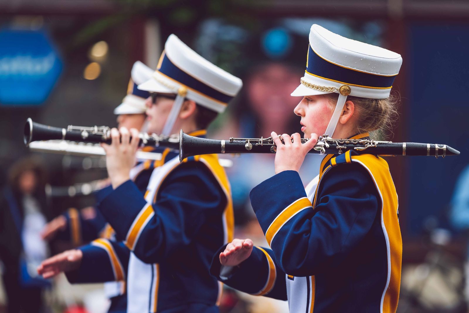 School band clarinet players in navy and gold uniforms performing, the heart of school band trips